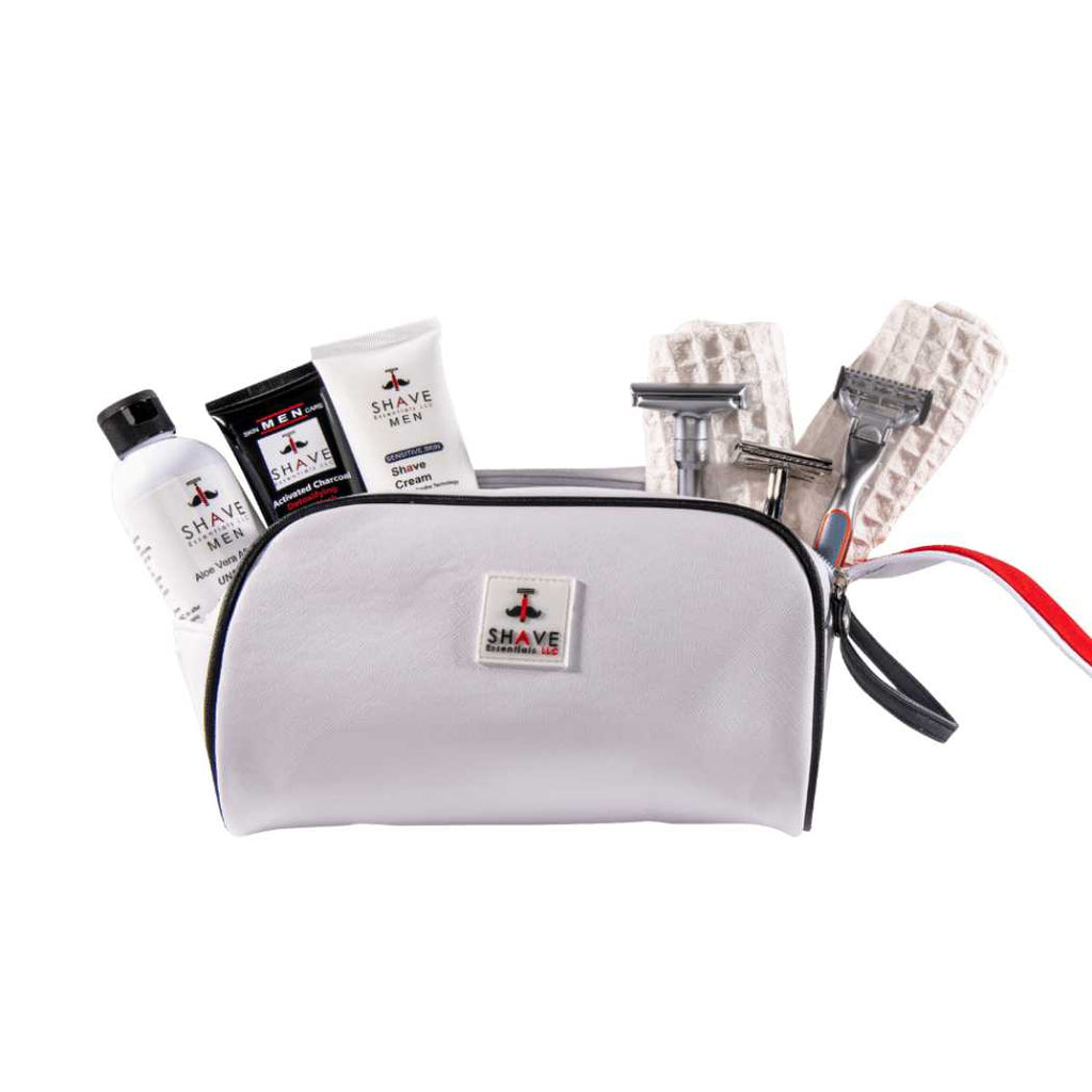 Gray zip grooming pouch with assorted shaving essentials and accessory packets