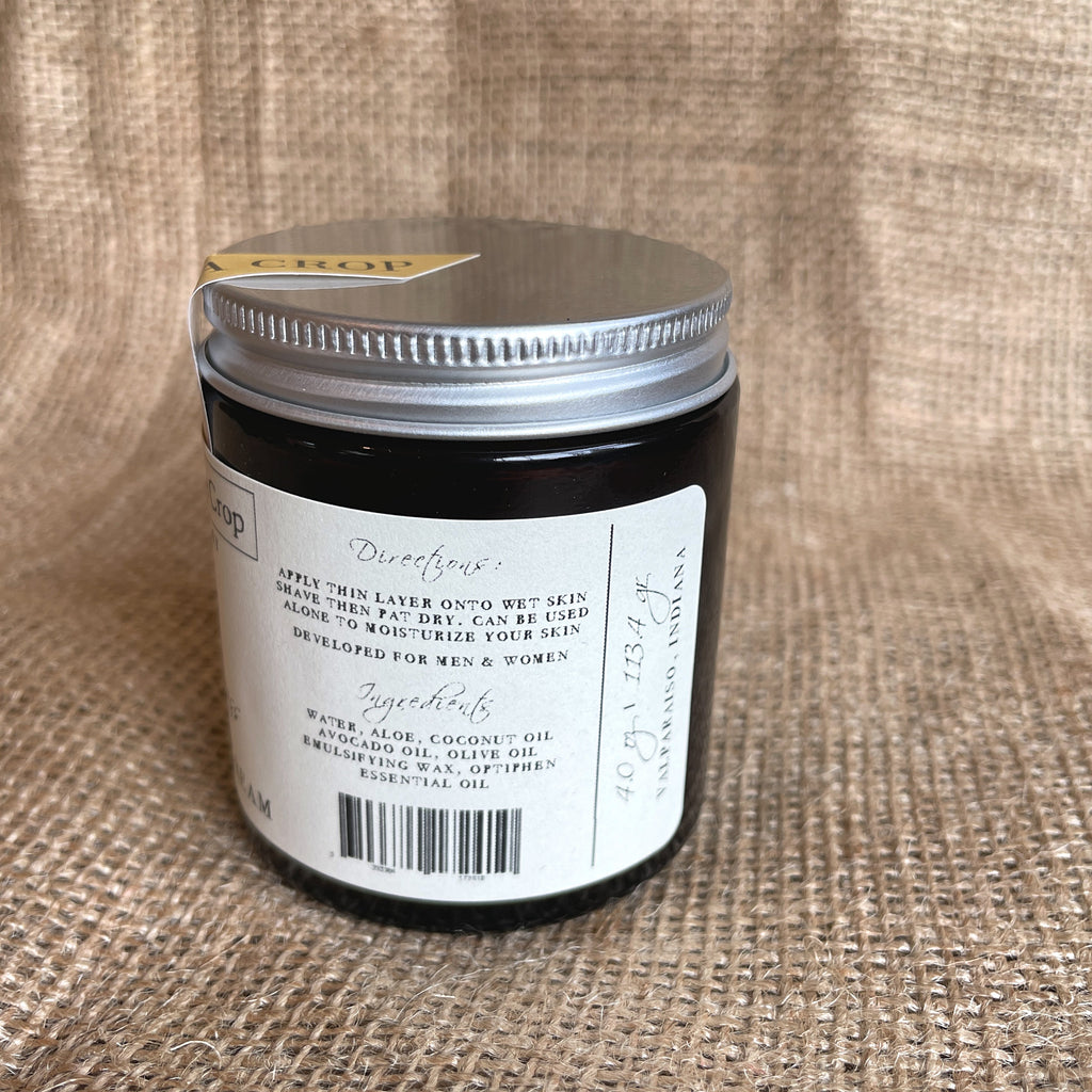 Moisturizing shaving cream jar, silver lid with ingredients and barcode on label