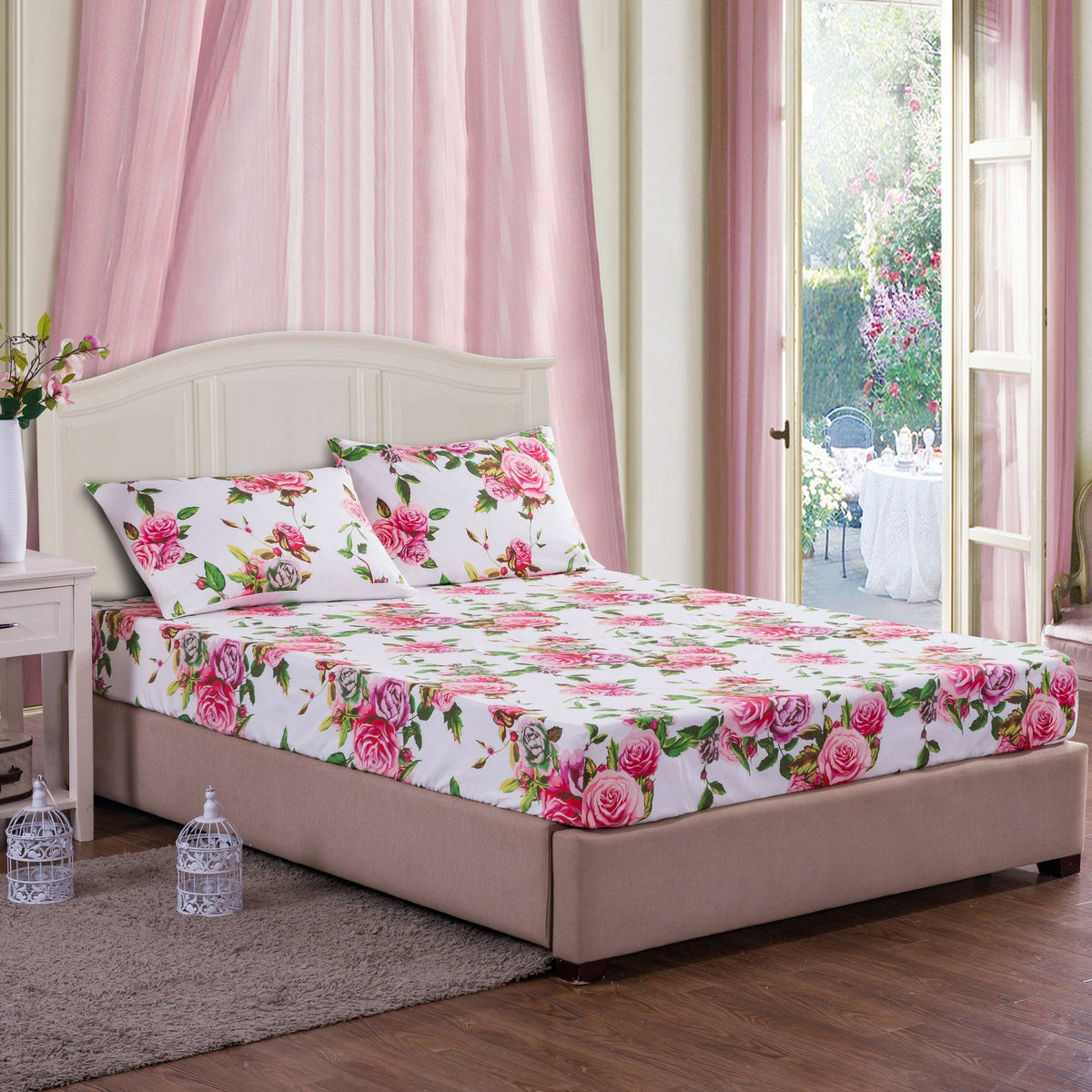 Pink rose floral fitted sheet set with two pillow cases on a bed