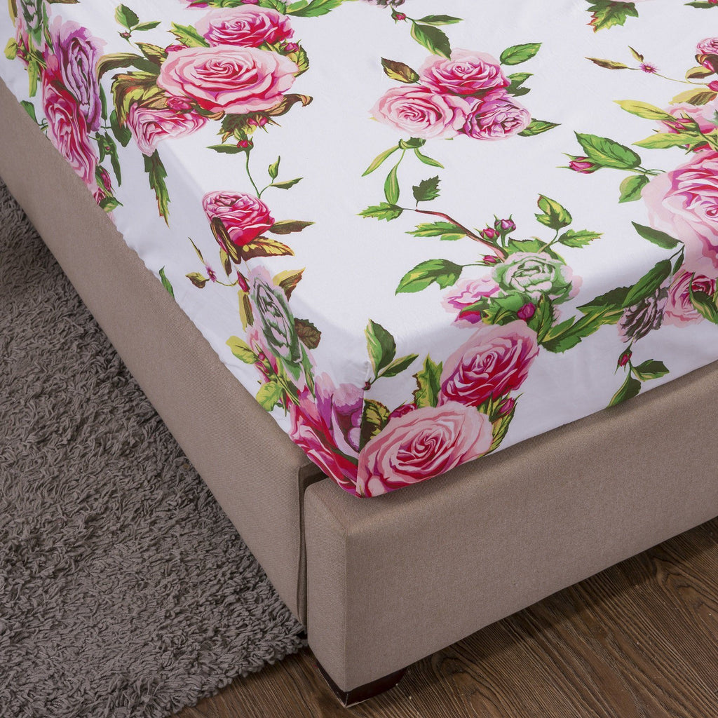 Pink rose floral fitted sheet corner with gray bed skirt and white base