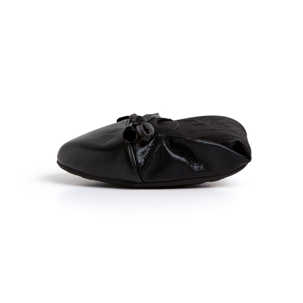 Black ballet flats with bow detail on toe and round low-profile shape