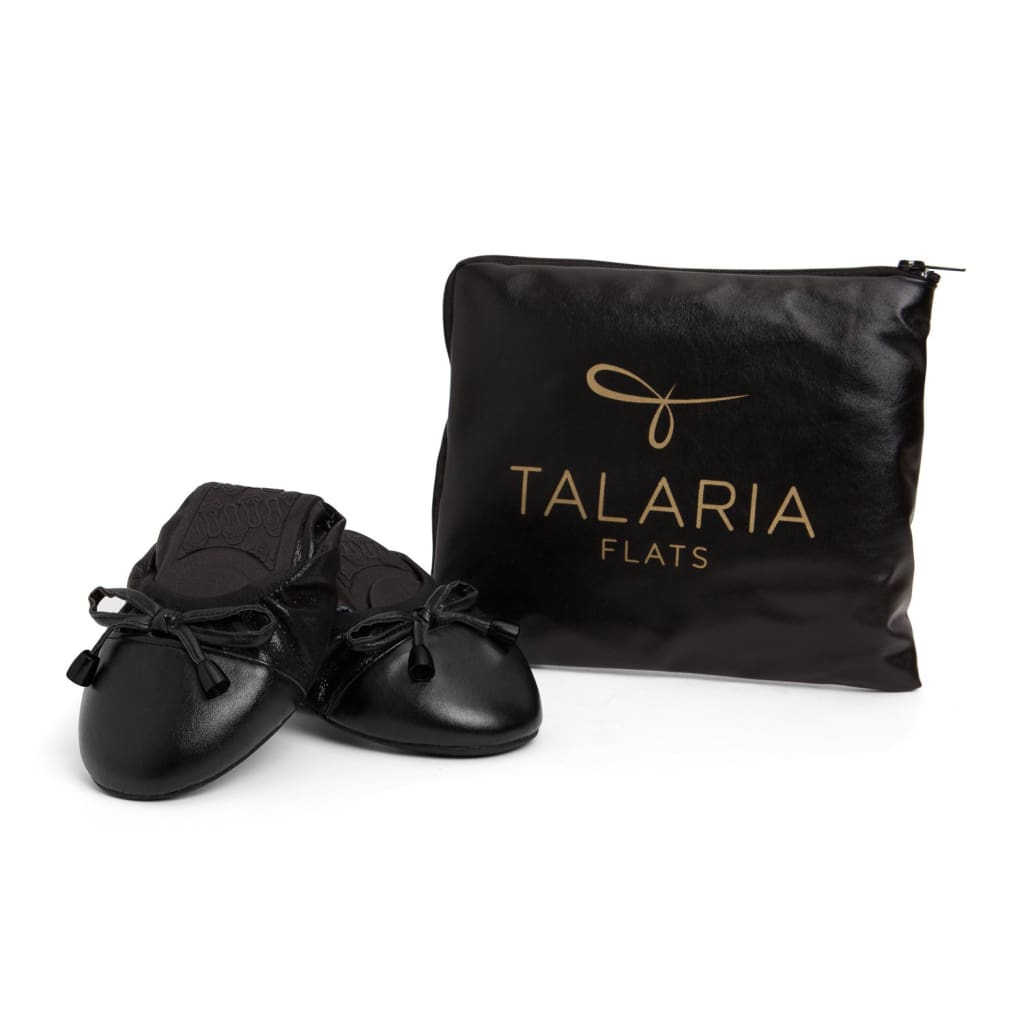 Black ballet flats with pouch labeled "TALARIA FLATS"