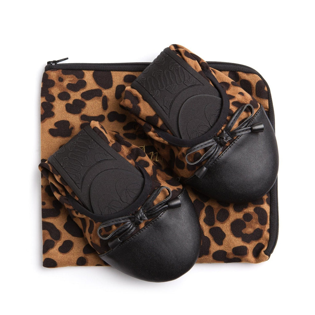 Leopard ballet flats with black bow and textured accents, shown with zip pouch