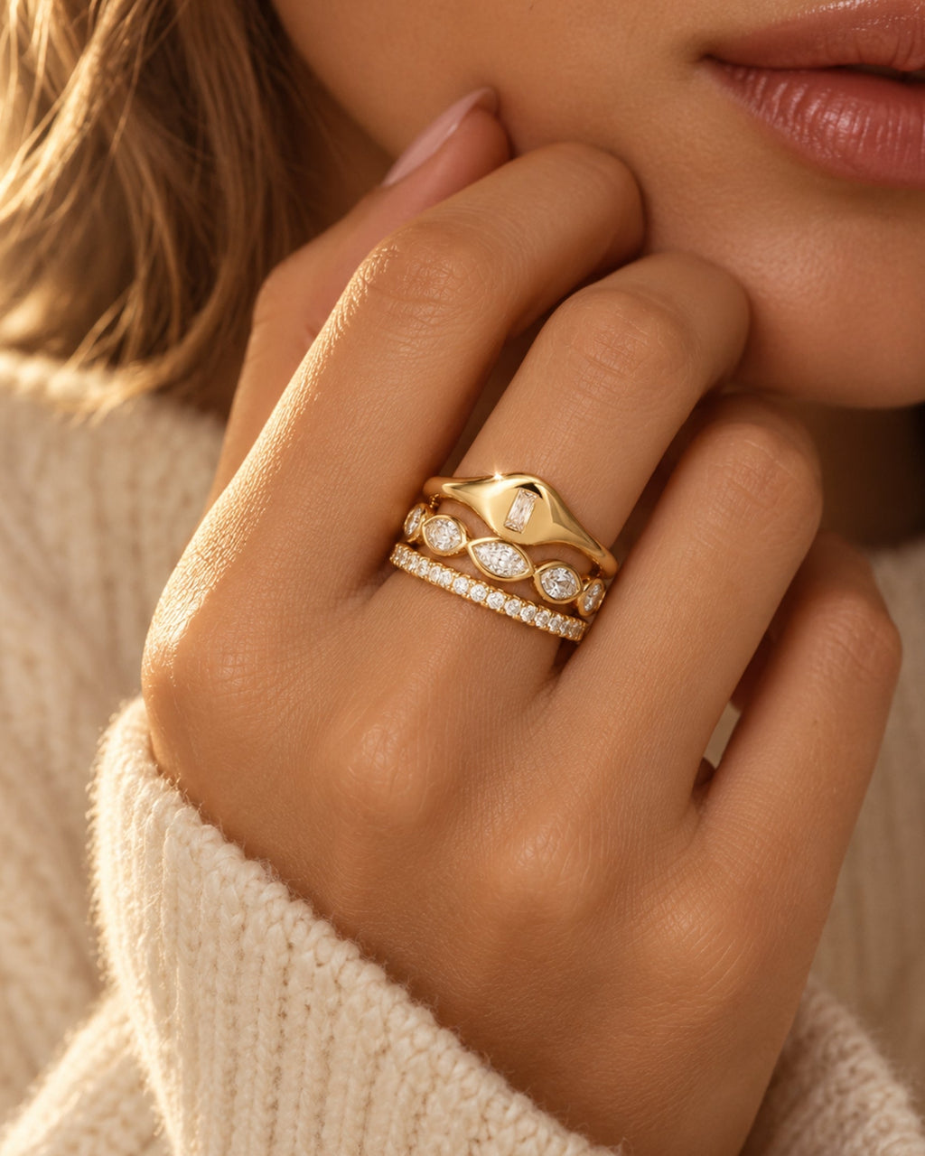 Gold marquise eternity band with sparkling clear gemstone settings on finger