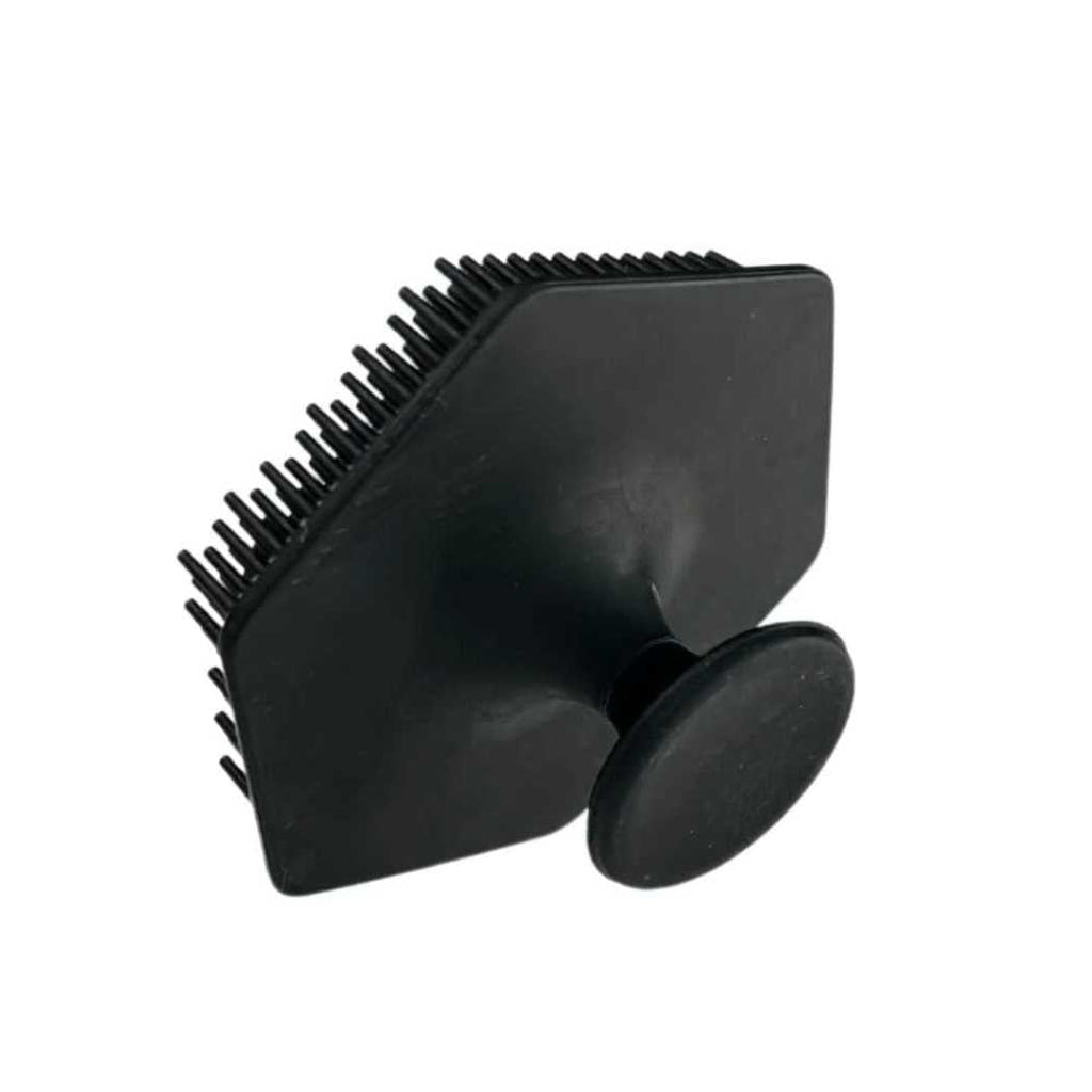 Black silicone face brush with suction-cup base and ridged scrub pad