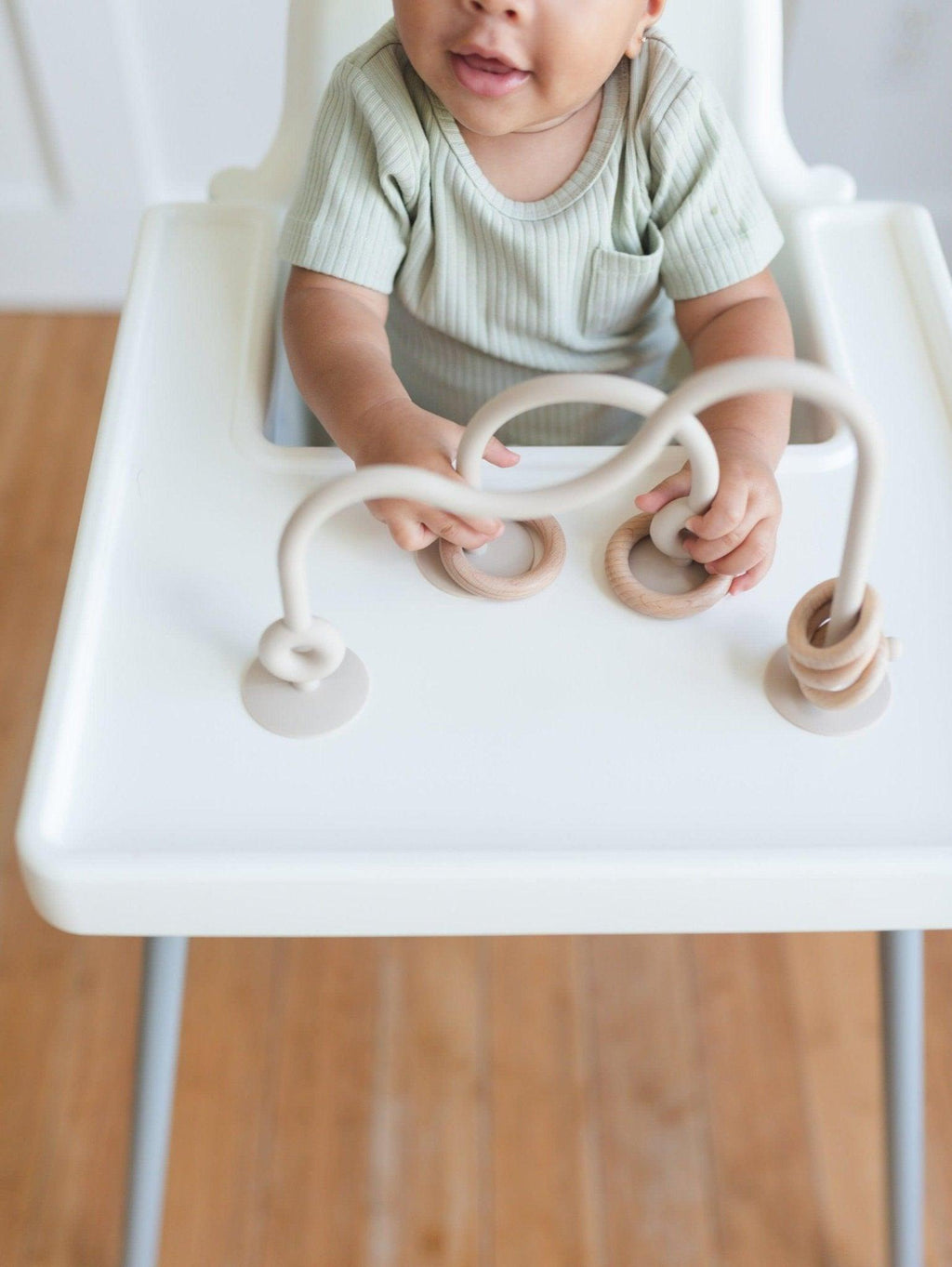 Silicone highchair toy set with cream loop arches and two bead rings