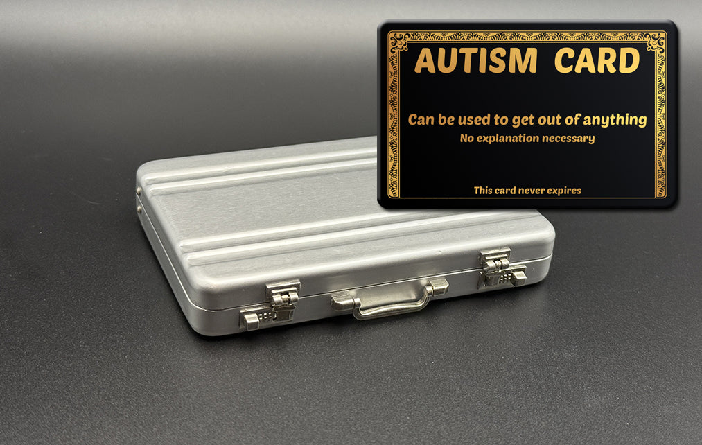 Mini briefcase, silver metal case with Autism card overlay
