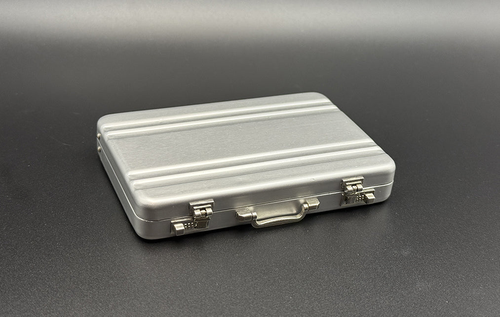 Mini briefcase, silver metal case with latch and top handle