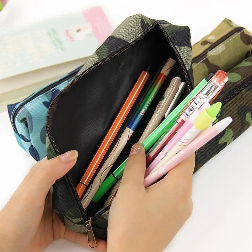 Open camouflage pencil pouch with zipper, holding colored pens and markers.