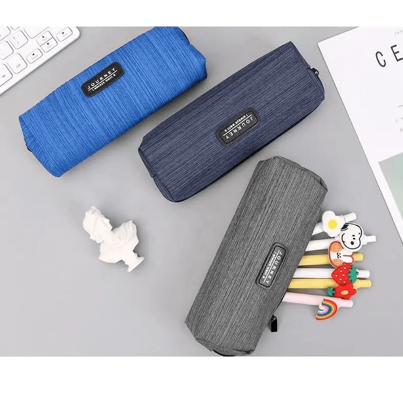 Small waterproof pencil cases in blue, navy, and gray with zipper and black brand tags