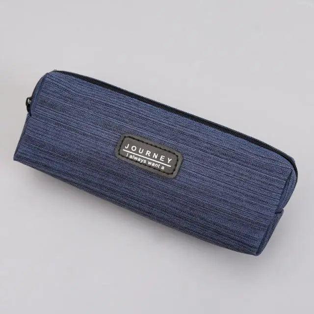 Small waterproof pencil case in dark navy fabric with zipper and centered brand patch