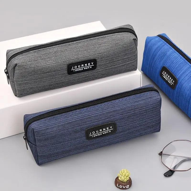 Small waterproof pencil case, dark gray fabric with zipper and black brand patch