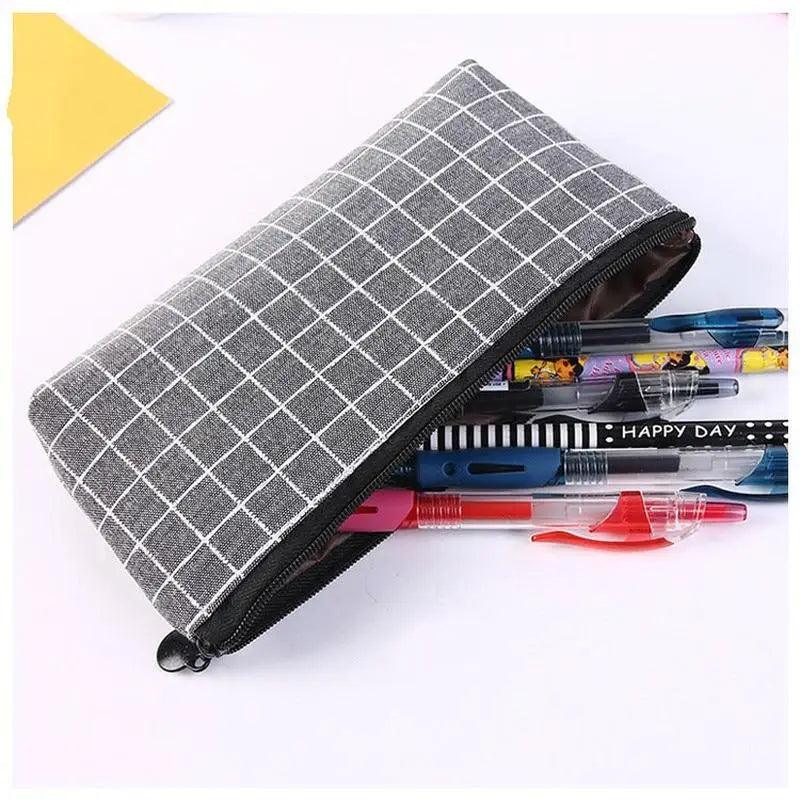 Dark gray grid pencil case with black zipper; holds pens inside, closed.