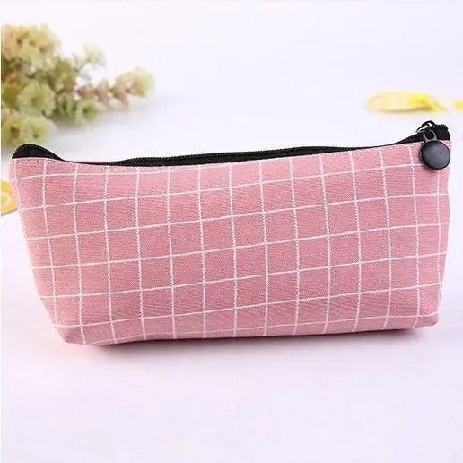 Maroon grid pencil case with black zipper and round black pull tab.