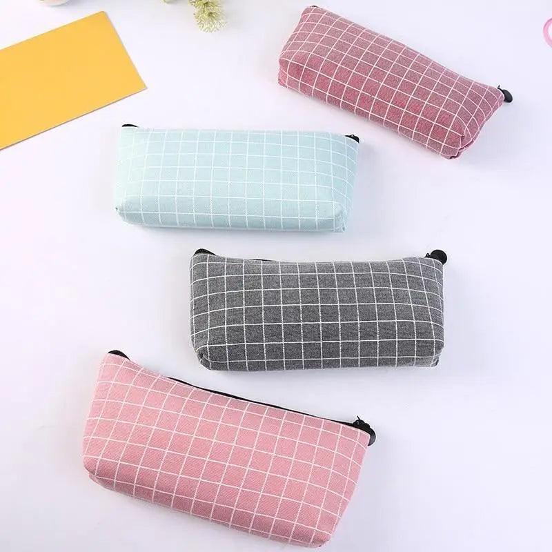 Multi-color grid pencil cases: mint, gray, and pink with black zipper pulls