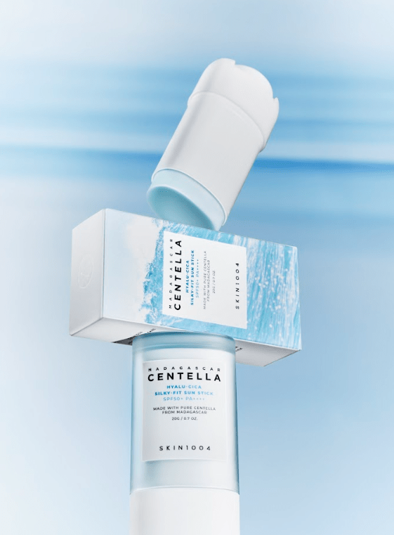 Sunscreen stick with Centella label and packaging box, white and light blue