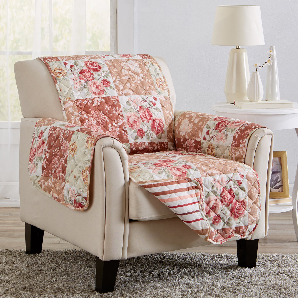 Reversible floral patchwork furniture protector in burgundy, taupe, and cream