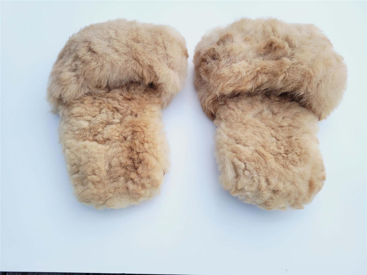 Set of tan plush fur slippers with open toe and rounded front
