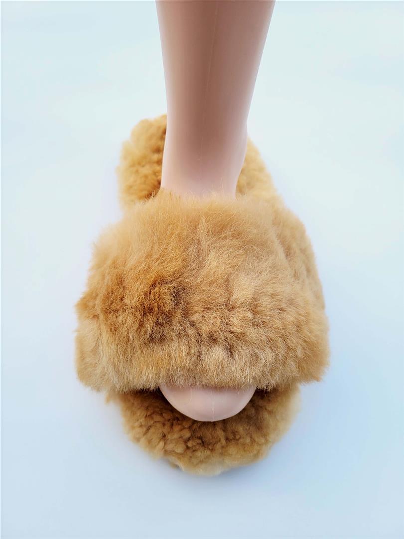 Tan fuzzy slide-in slippers with low cuff and open foot opening