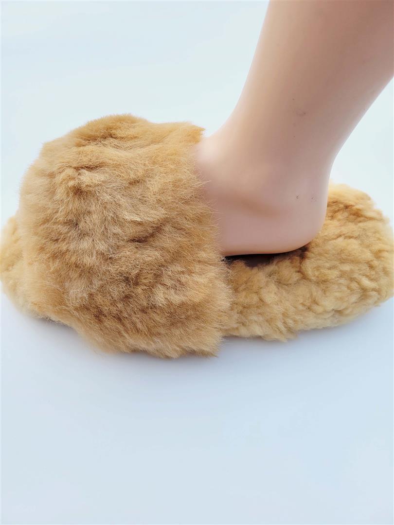 Tan fluffy slide-in slippers with plush fur upper and open toe