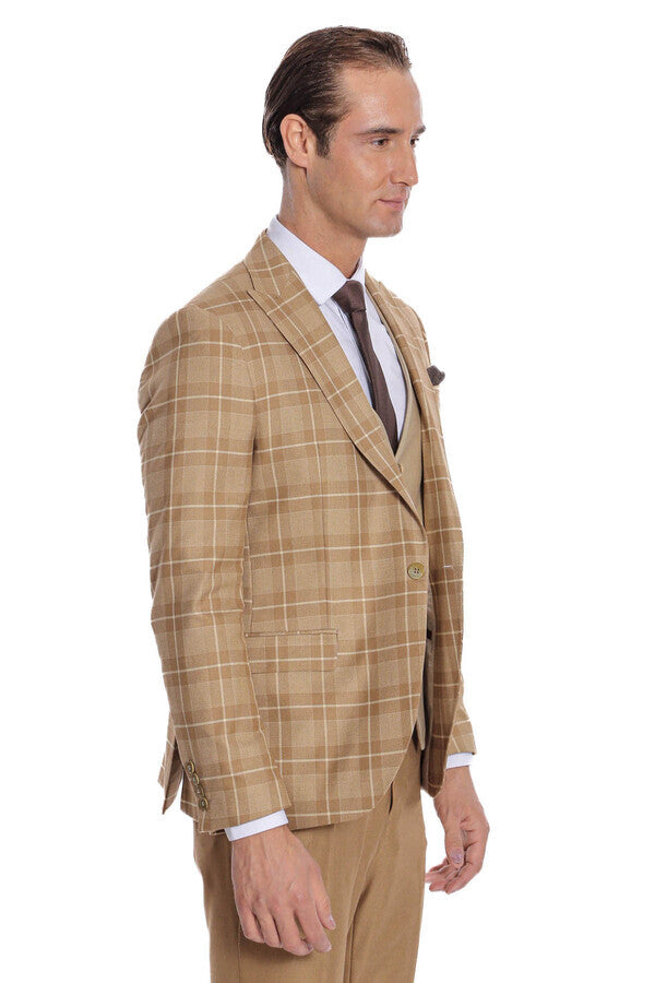 Men's checked tan blazer with beige waistcoat and dark tie, left side profile