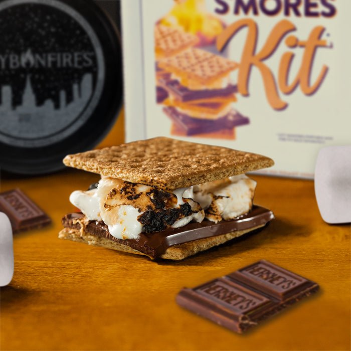 Stacked s'more with melted marshmallow and chocolate between graham crackers