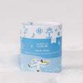 Blue and white herbal tea tin with lid and winter-themed illustration