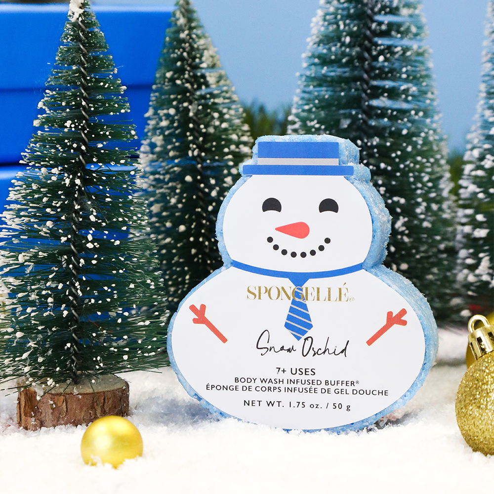 Snowman-shaped body buffer with Snow Orchid label and blue hat design