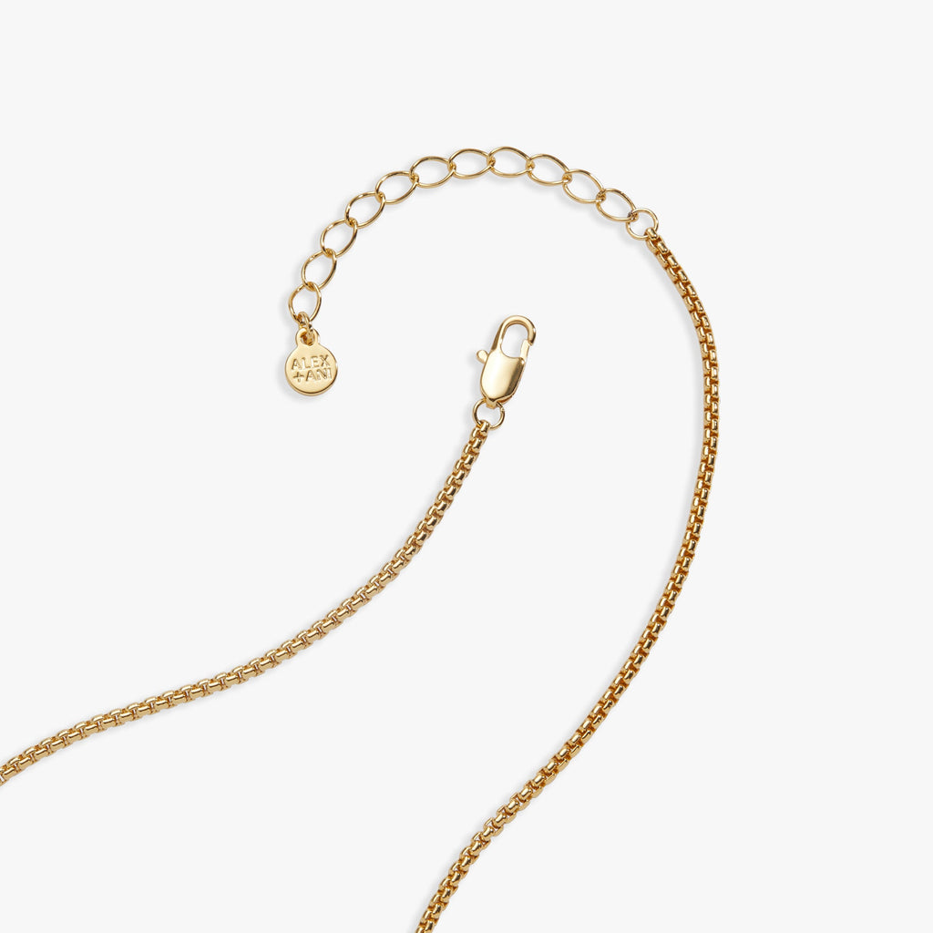 Gold necklace chain with clasp and small circular charm tags