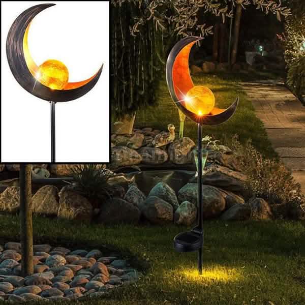 Solar LED flame stake lights with swirling metal forms and glowing amber spheres