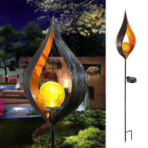 Solar LED flame stake lantern with leaf-shaped dark metal and glowing amber bulb