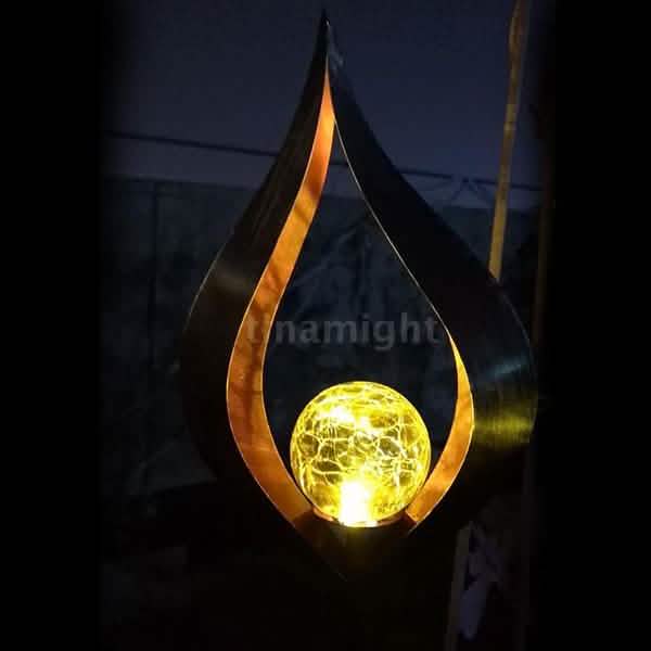 Flame-shaped solar LED lantern lamp with glowing yellow simulated flame