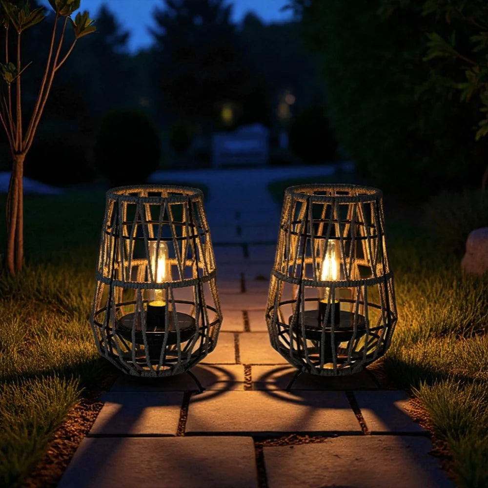 Set of 2 solar outdoor lanterns, black woven cage design with warm glow bulbs