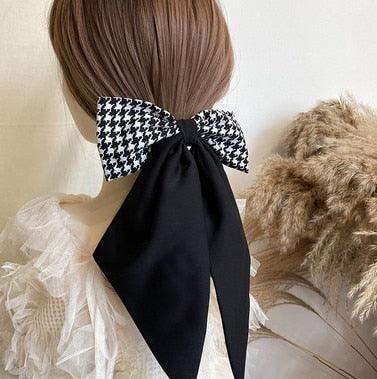 Black and white houndstooth satin bow hair clip with long ribbon tails