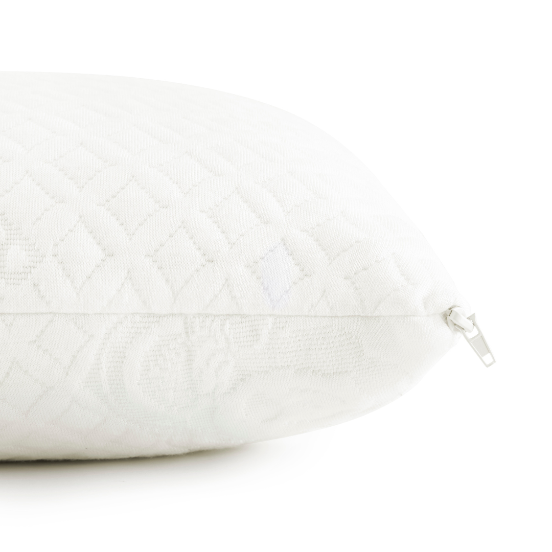 White quilted pillow with visible zipper along the side seam