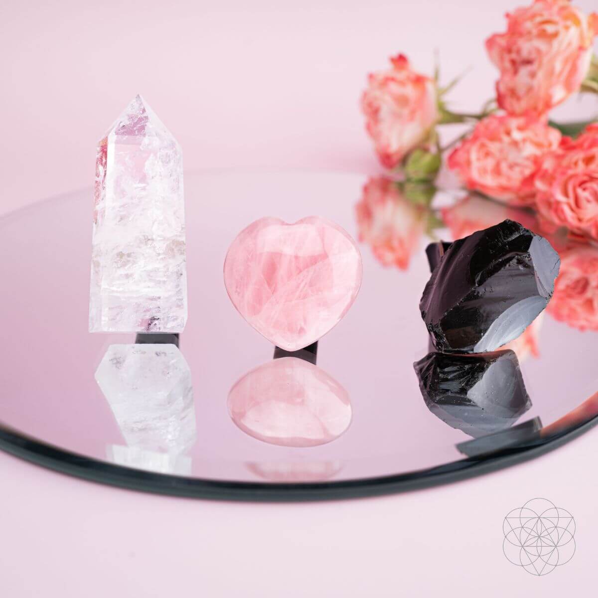 Decorative crystal set with rose quartz heart, clear quartz points, and dark crystal pieces