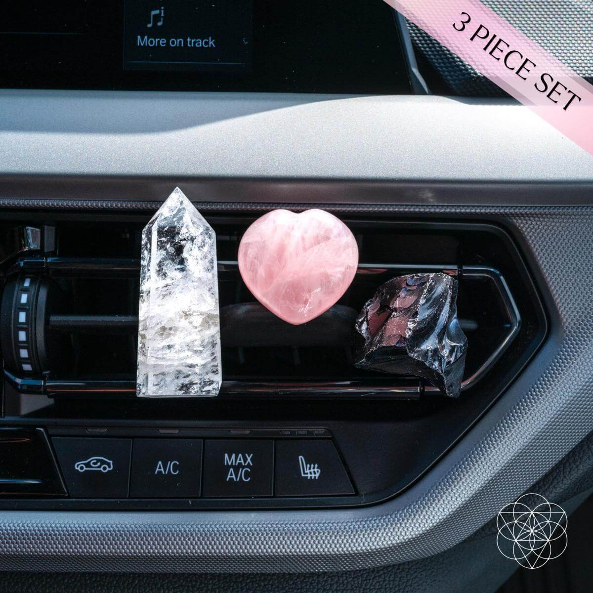 Car crystal accessory set with rose quartz heart, clear tower, and black crystal pieces