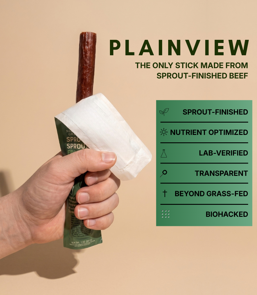 Hand holding wrapped beef stick with green pouch text panel, sprout-finished claims