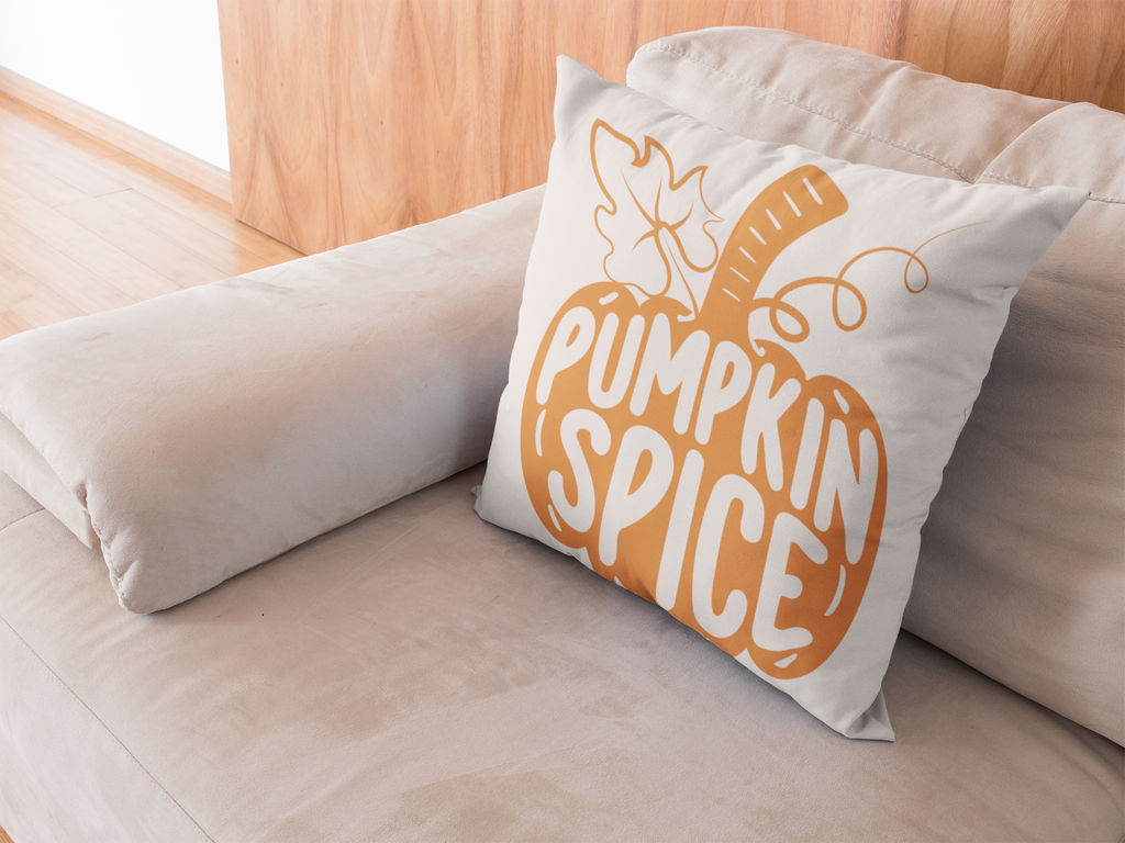 Beige sofa throw pillow with orange pumpkin spice front graphic