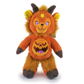 Orange plush monster bear with purple eyes, yellow star, and jack-o'-lantern belly