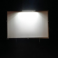 Solar flood light with rectangular panel and metal frame, bright white light