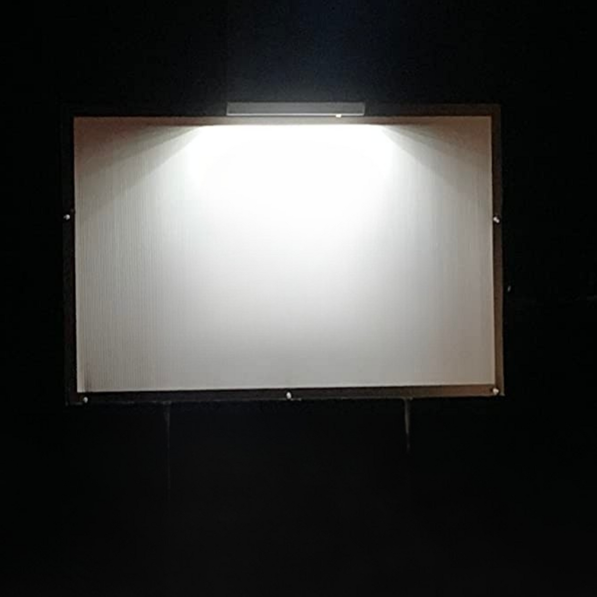 Solar flood light with rectangular panel and metal frame, bright white light