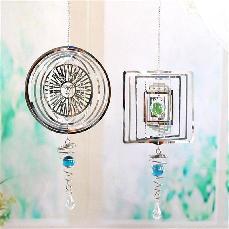 Circular metal wind chime pendant with sun face, blue bead, and clear crystal drops
