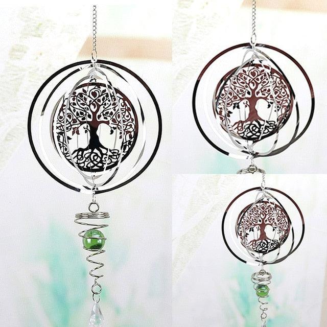 Round metal wind chime pendant with tree-of-life design, green bead, and clear crystal