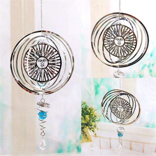 Circular metal wind spinners with silver rings, blue glass bead, and clear crystal drops