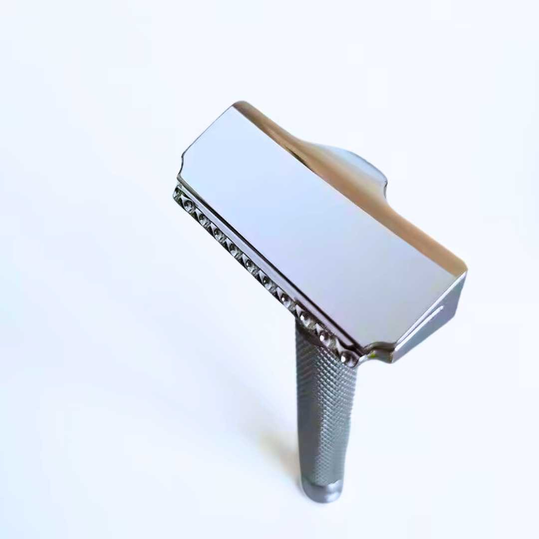 Polished safety razor with textured handle and close double-edge head view