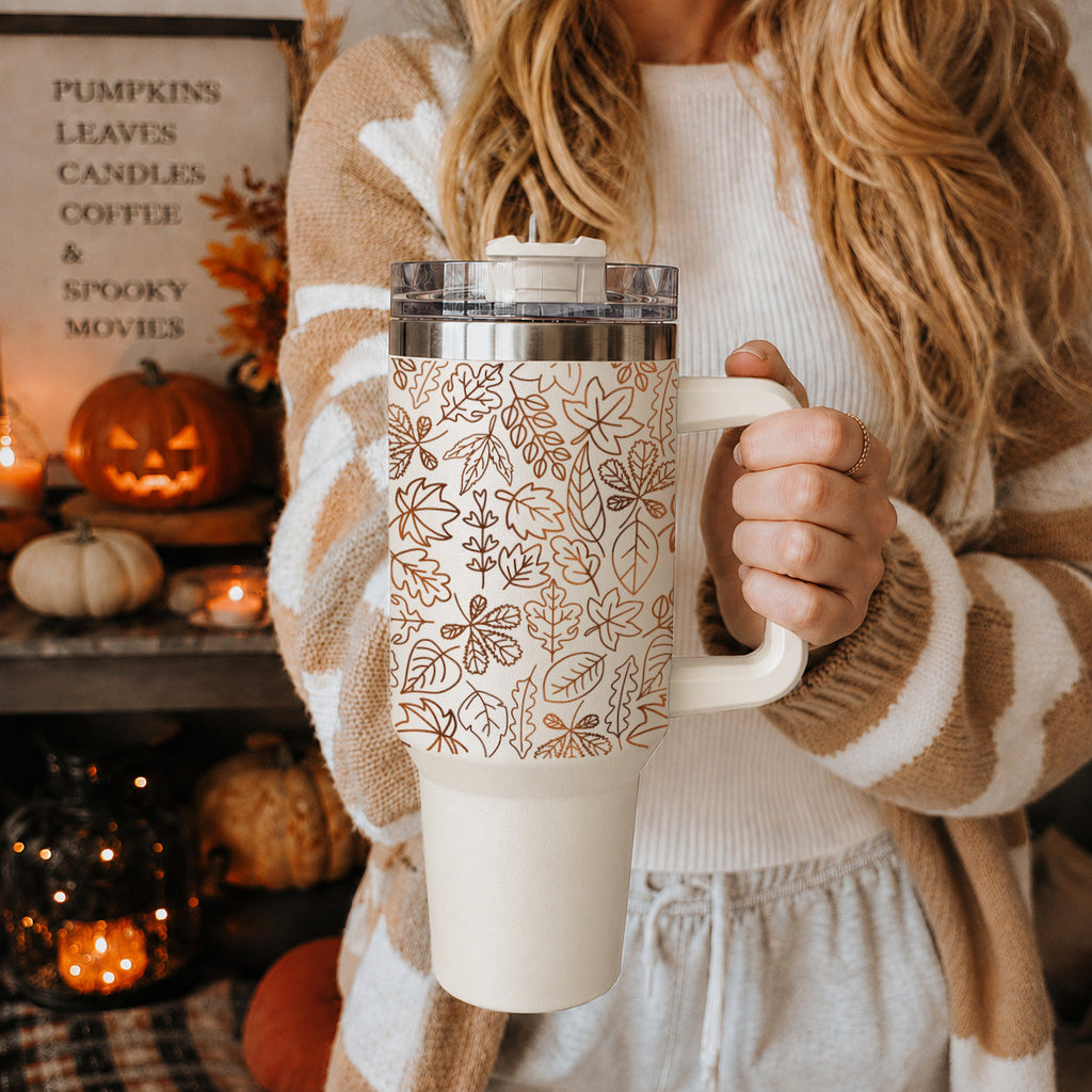 40oz insulated tumbler with white handle, clear lid, and orange leaf pattern
