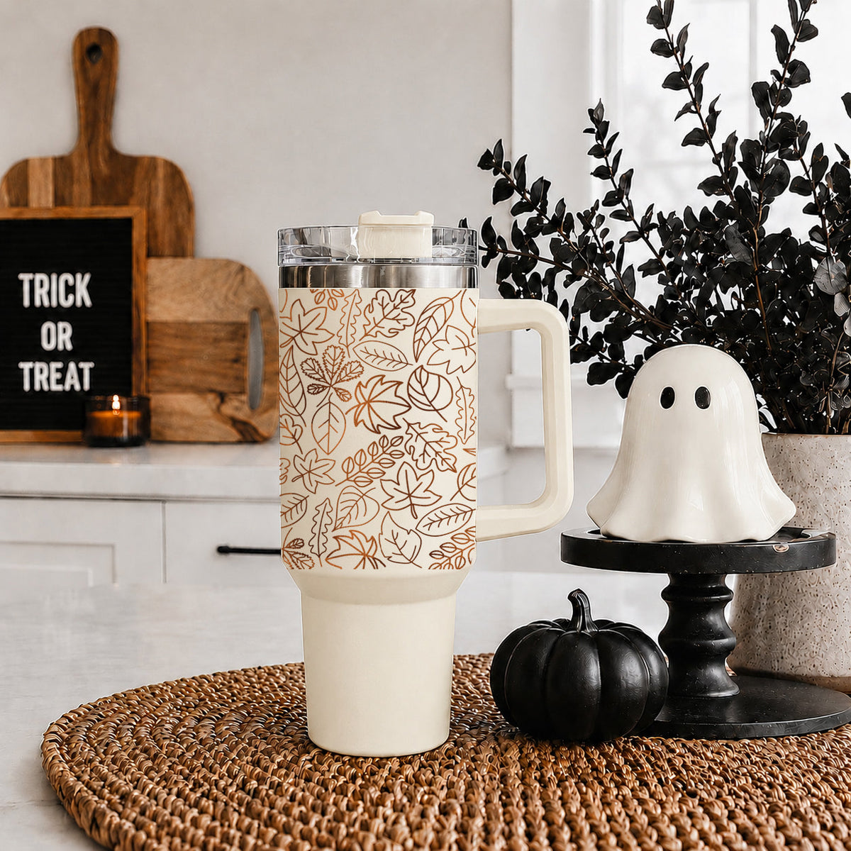 40oz insulated tumbler with white handle, clear lid, and orange leaf pattern wrap
