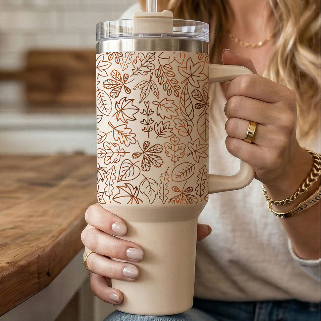 40oz insulated tumbler with orange leaf print pattern and white handle cup