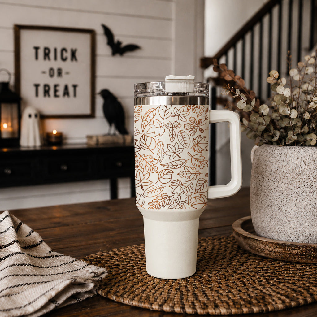 40oz insulated tumbler with clear lid, white base, and orange leaf pattern